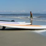 paddle boards on seashore