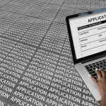 filling up a job application in a laptop